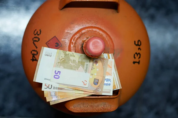 Spanish butane gas cylinder insulated with 50 euro bills on top of it