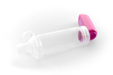 Lung medication with corticosteroids for asthma or COPD. An inhaler with spacer with white background.