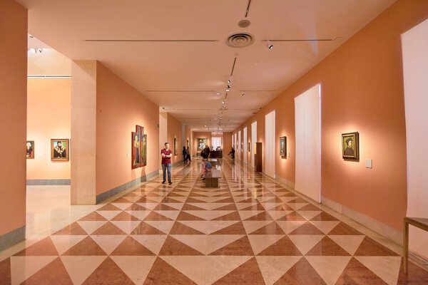 MADRID SPAIN - July 31, 2023: Exhibition room of the Museo Nacional Thyssen-Bornemisza with people inside observing the works.