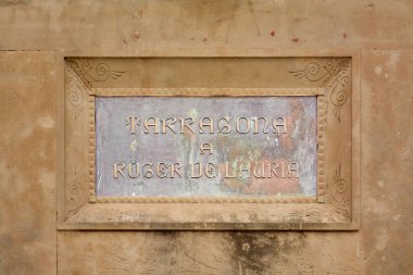 Tarragona, Spain - April 11, 2024: Plaque to Roger de Lauria, admiral of the Crown of Aragon, stands proudly in Tarragona, reflecting Catalan maritime clipart