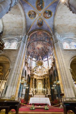 Lugo, Spain - May 10, 2024: Lugo Cathedral is presented in all its splendor, showing a richly decorated altar under subtle and elegant lighting. clipart