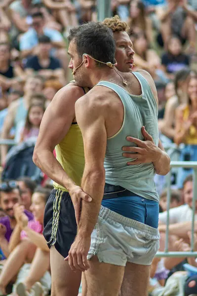 stock image Viladecasn, SPAIN - JULY 12, 2024: Two athletes move to the rhythm of music at a public event, showcasing their ability to blend sport and art in a street dance.