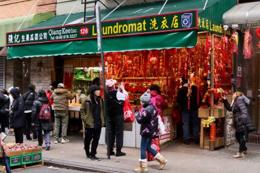 New York, United States -September 14,2024: Shop in New York Chinatown with red and gold festive decorations, showcasing the vibrant cultural atmosphere and preparations for Chinese New Year. clipart