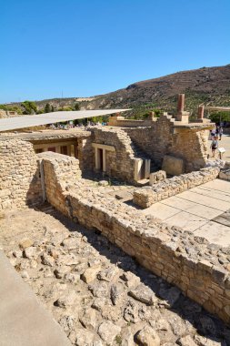Crete.Greece - may 05, 2025: Knossos ruins welcome tourists seeking knowledge of the ancient world, with pathways leading through its monumental stone walls.