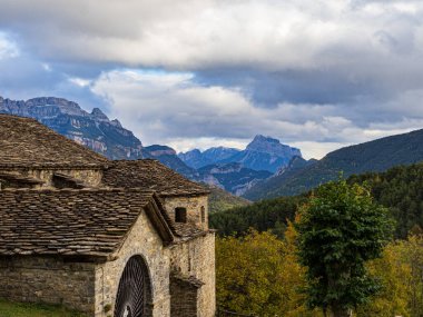 View of the Church of Fanlo, in the Aragonese Pyrenees with moun clipart