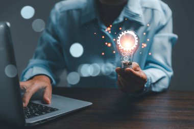 woman Hand holding Light bulb Global Internet connection. Business global internet connection application technology and digital marketing, Financial and banking, Digital link tech, big data.