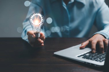 woman Hand holding Light bulb Global Internet connection. Business global internet connection application technology and digital marketing, Financial and banking, Digital link tech, big data.
