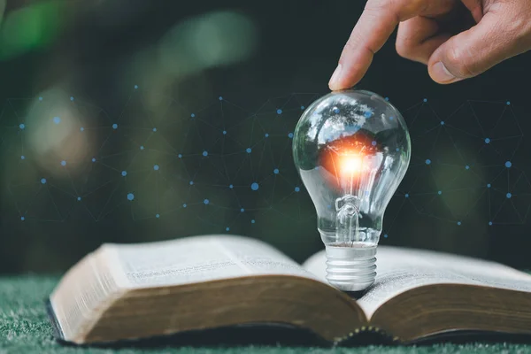 stock image Bright light bulb and icon with book. Business success idea and education or learning online concept. Business person achievement and inspiration. technology, Create Imagination for Inspiration.