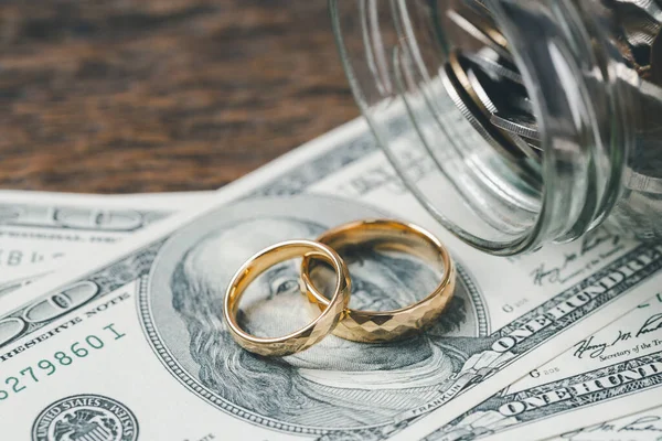 stock image Save money and planning wedding concept. Sustainable financial goal for family life or married life. Rings with stack of coins, saving money for marry, depicts savings or growth for new family.