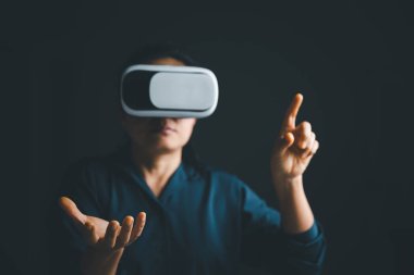 Woman with glasses of virtual reality. Future technology concept. Metaverse technology concept. VR virtual reality goggles. Futuristic lifestyle. female using virtual reality headset at home office.