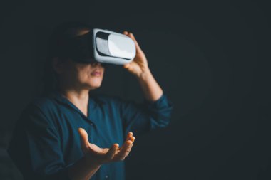 Woman with glasses of virtual reality. Future technology concept. Metaverse technology concept. VR virtual reality goggles. Futuristic lifestyle. female using virtual reality headset at home office.