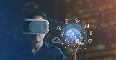 Businesswoman wearing VR glasses and accessing the Cloud Computing Technology Internet Storage Network Concept And a large database big data Through internet technology. Metaverse technology idea.