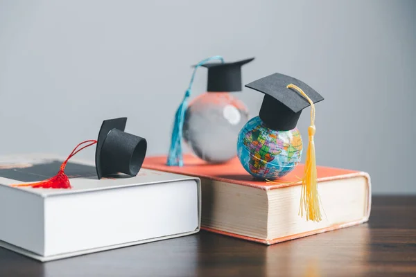 stock image Graduation cap with Earth globe. Concept of global business study, abroad educational, Back to School. Education in Global world, Study abroad business in universities in worldwide. language study