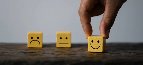 stock image Innovative Business Strategies: Hand Holding Wooden Cube Icon for Growth, Technology, and Teamwork. Global Business Concept: Wooden Cube Icon for Customer Satisfaction, Success, and Collaboration.