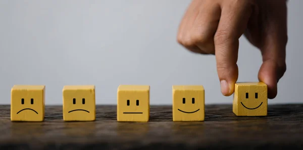 stock image Innovative Business Strategies: Hand Holding Wooden Cube Icon for Growth, Technology, and Teamwork. Global Business Concept: Wooden Cube Icon for Customer Satisfaction, Success, and Collaboration.