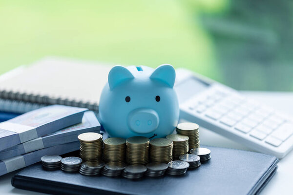 Stack coin with pig saving. a pile of coins, business, investment, finance, and Money Saving for future concepts, save money.