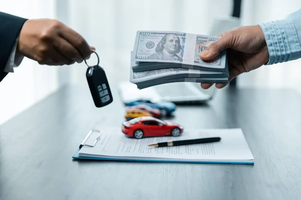 Closeup Hand Giving Car Key Money Loan Credit Financial Lease — Zdjęcie stockowe