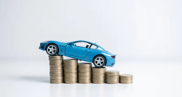car on stacks of coin, car loan, Saving money for car concept, trade car for cash concept, finance concept. Car toy vehicle with stack coin money. Planning to manage transportation finance costs.