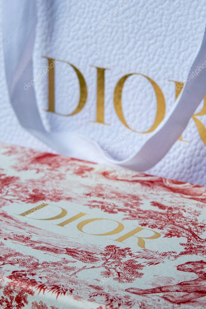 Riga, Latvia - August 02, 2025: Dior packaging features a stylish shopping bag and decorative box, highlighting luxury and sophistication in fashion retail