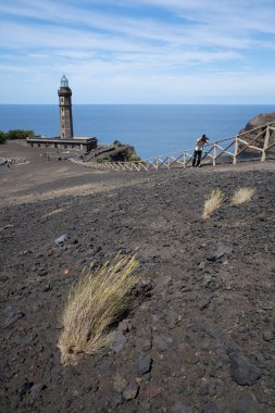 Footpath in the geopark Ponta dos Capelinhos on western coast on Faial island, Azores clipart