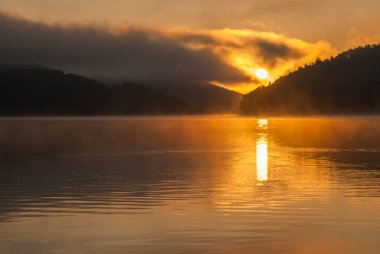 colored sunrise on the lake, colored water