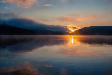 colored sunrise on the lake, colored water