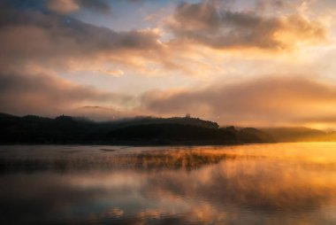 colored sunrise on the lake, colored water