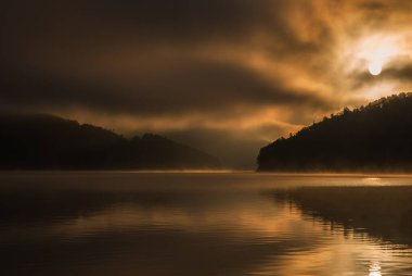 colored sunrise on the lake, colored water