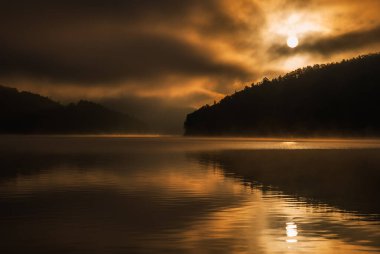colored sunrise on the lake, colored water