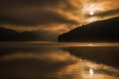 colored sunrise on the lake, colored water