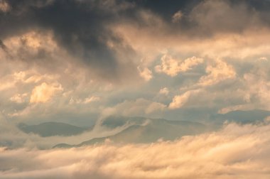 fog and clouds on the valley at sunset