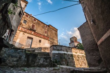 clock tower between the alleys