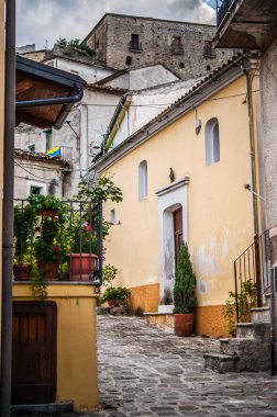 facades of ancient houses in the alley