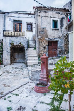 ancient rusty iron fountain in the historic center