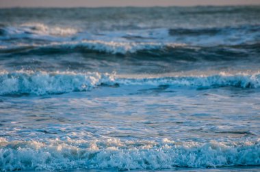 waves at sunrise sea at morning, colorful sea