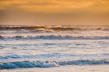 waves at sunrise sea at morning, colorful sea