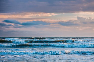 waves at sunrise sea at morning, colorful sea