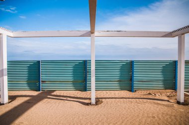 fence on the  beach in winter time 