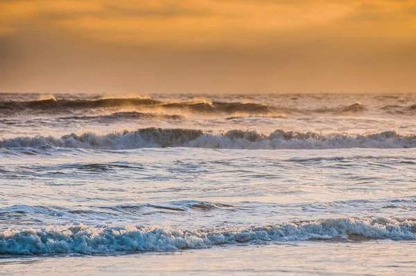 waves at sunrise sea at morning, colorful sea