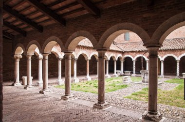 colonnade and well water in the yard of the abbey