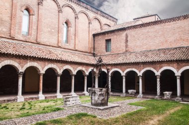 colonnade and well water in the yard of the abbey