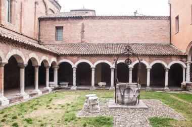 colonnade and well water in the yard of the abbey