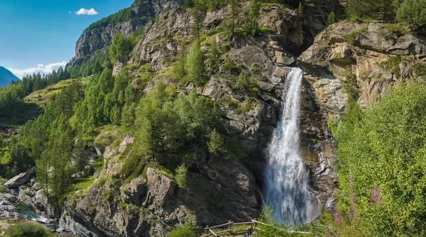 stock image stream flows among the rocks and creates an alpine waterfall