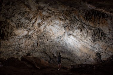 large central chamber of the cave with columns of stalactites and stalagmites