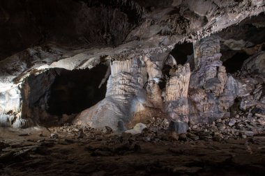 large central chamber of the cave with columns of stalactites and stalagmites