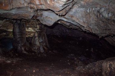 large central chamber of the cave with columns of stalactites and stalagmites