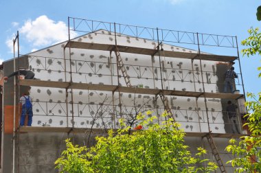 The outer walls of the house are insulated with foam