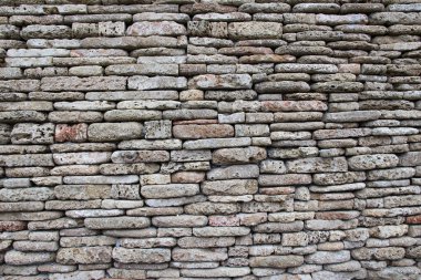 The wall is built of natural stone