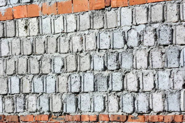 A fragment of the masonry wall of the building