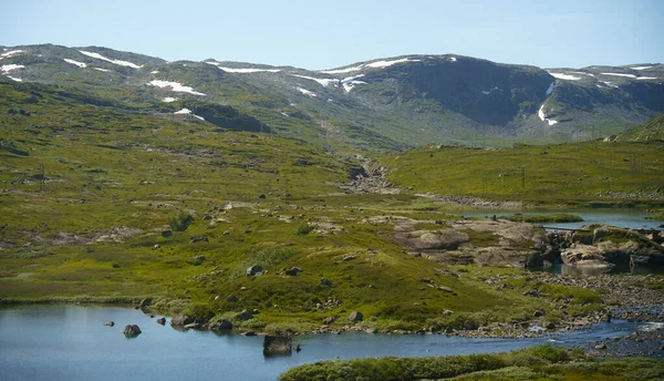 stock image Beautiful view on the mountains and lake of the hardanger plateau national park in Norway at summer